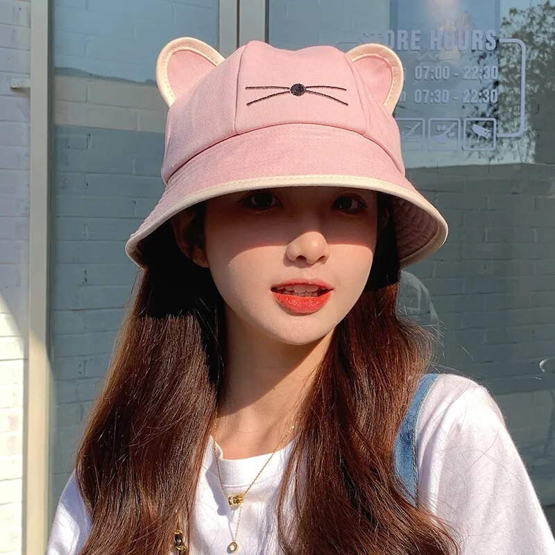 Girl wearing a Kitten Bucket Hat